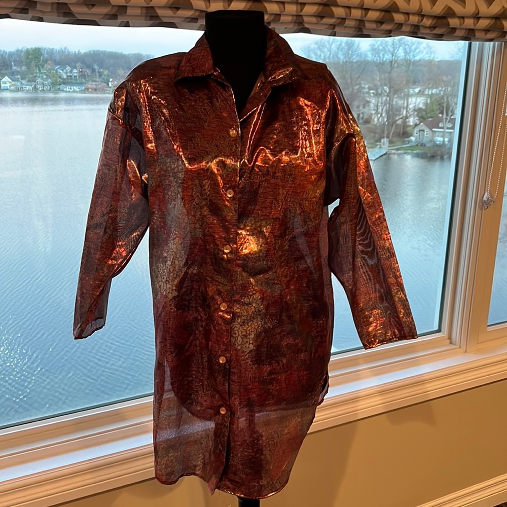 Shiny  80 ‘s shoulder pad shirt by Mirrors size small. 100 percent nylon